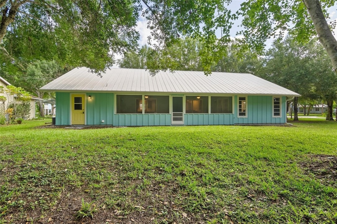 6515 5th Street Vero Beach, FL 32968 - Photo 34 of 36 a view of a house with a backyard