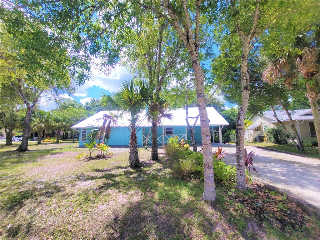 6515 5th Street Vero Beach, FL 32968 - Photo 35 of 36 a view of a house with a yard and sitting area