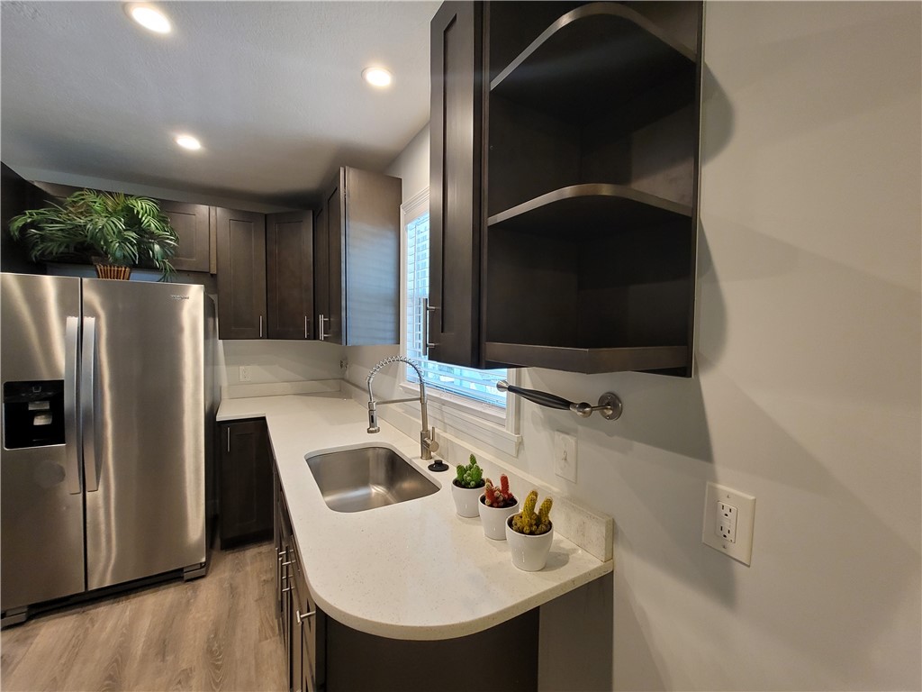 6515 5th Street Vero Beach, FL 32968 - Photo 5 of 36 a bathroom with a sink and a mirror