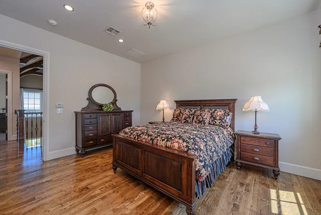 a bed room with a bed and dresser