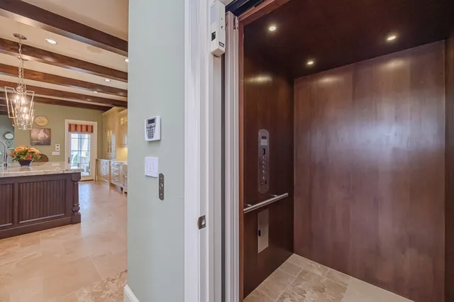 a bedroom with a bed and cabinets