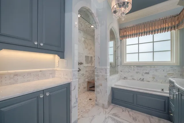 a view of a garage with furniture and a ceiling fan
