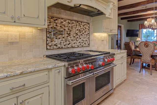 a kitchen with granite countertop a stove and a cabinet