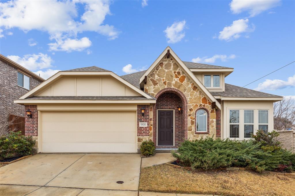 a front view of a house with yard