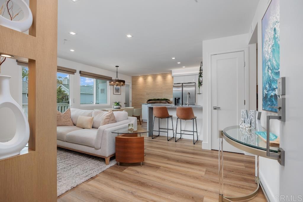 105 Mangano Circle Encinitas, CA 92024 - Photo 1 of 1 a living room with furniture a wooden floor and a large window