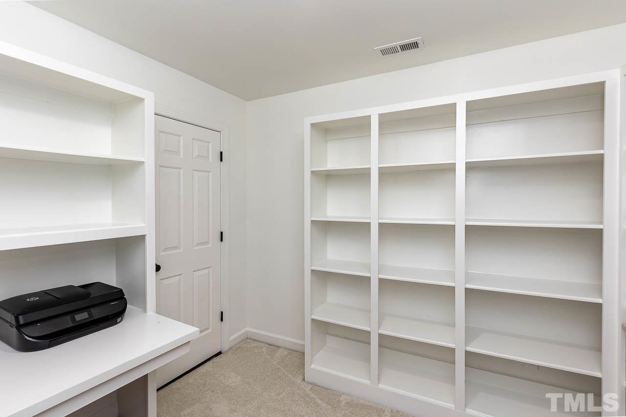 6701 Pointe Vista Circle Raleigh, NC 27615 - Photo 10 of 11 Quiet, second floor office with BUILT IN BOOKSHELVES, Desk and an access door to the 1,100 square foot ENORMOUS, WALK IN, FLOORED unfinished attic.