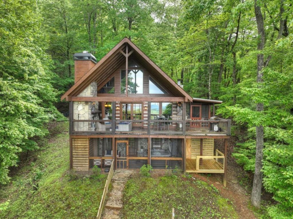 181 Ridge Circle Blue Ridge, GA 30513 - Photo 1 of 59 a front view of a house with a yard