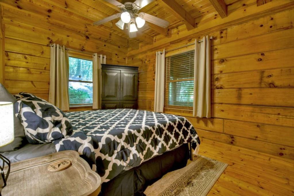 181 Ridge Circle Blue Ridge, GA 30513 - Photo 30 of 59 a bedroom with a bed and a window