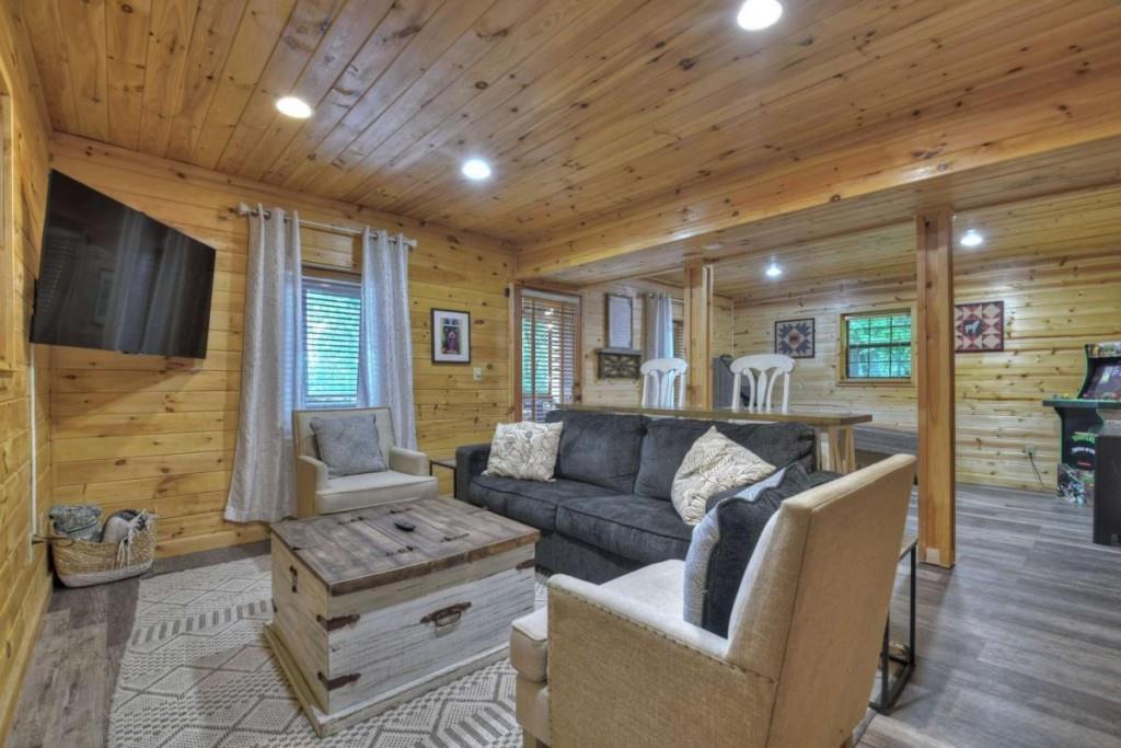 181 Ridge Circle Blue Ridge, GA 30513 - Photo 38 of 59 a living room with furniture and a flat screen tv