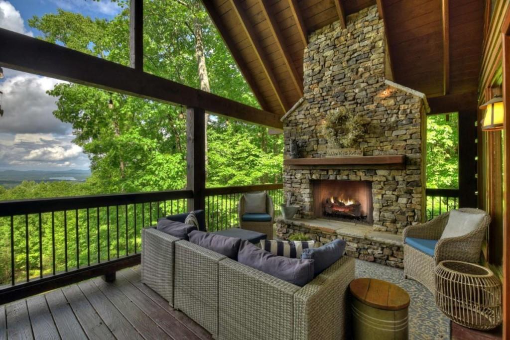 181 Ridge Circle Blue Ridge, GA 30513 - Photo 4 of 59 a balcony with furniture and a fireplace