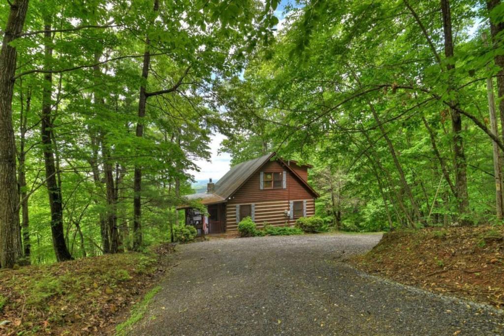 181 Ridge Circle Blue Ridge, GA 30513 - Photo 55 of 59 a front view of a house with garden