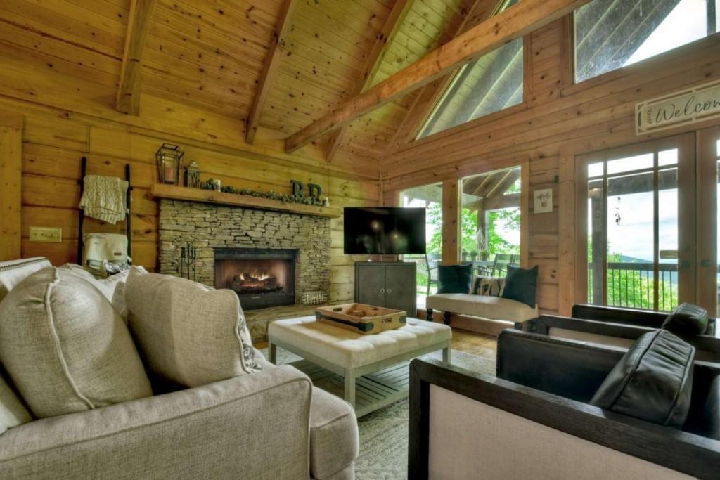 181 Ridge Circle Blue Ridge, GA 30513 - Photo 6 of 59 a living room with furniture and a fireplace