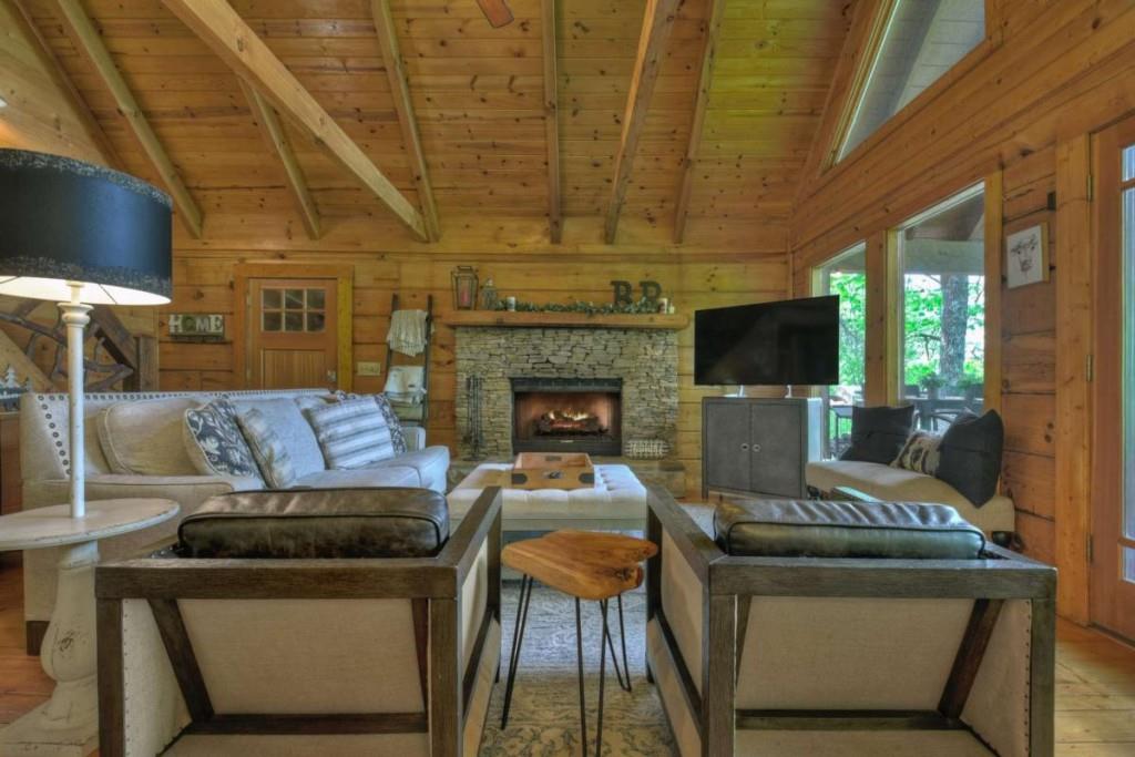 181 Ridge Circle Blue Ridge, GA 30513 - Photo 7 of 59 a living room with furniture and a fireplace