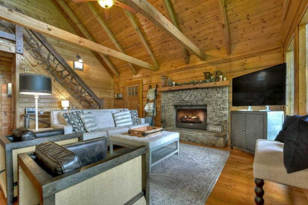 181 Ridge Circle Blue Ridge, GA 30513 - Photo 8 of 59 a living room with furniture and a flat screen tv