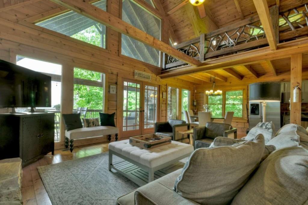 181 Ridge Circle Blue Ridge, GA 30513 - Photo 9 of 59 a living room with furniture and a large window