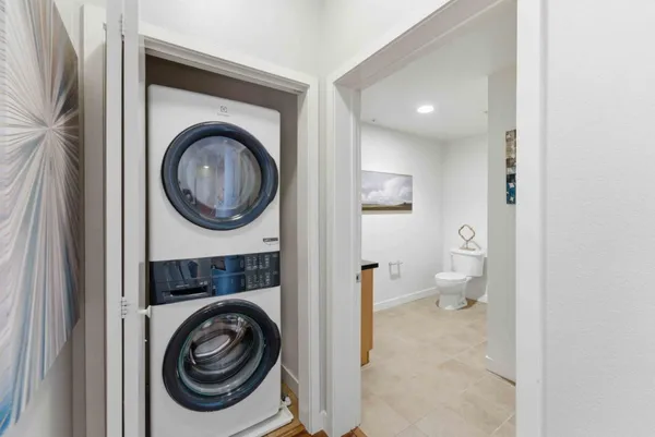 a view of a hallway with washer and dryer