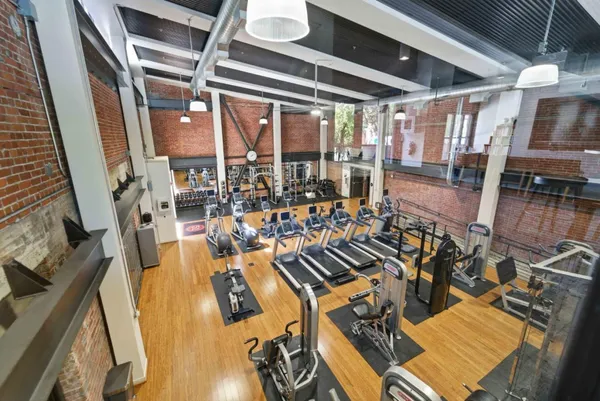 a view of a livingroom with furniture and floor to ceiling window