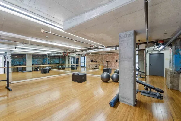 a view of living room with furniture and wooden floor