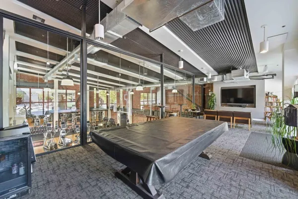 a view of a living room and dining room