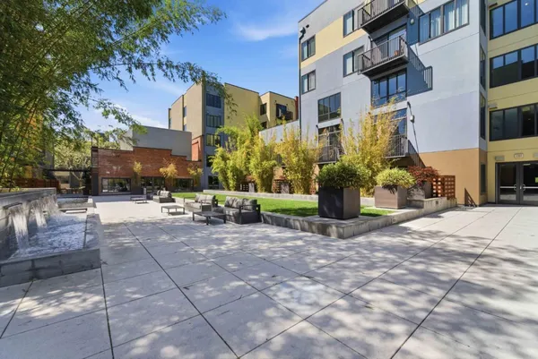 a view of a building with sitting area