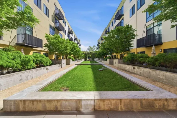 a view of a street with a building in the background