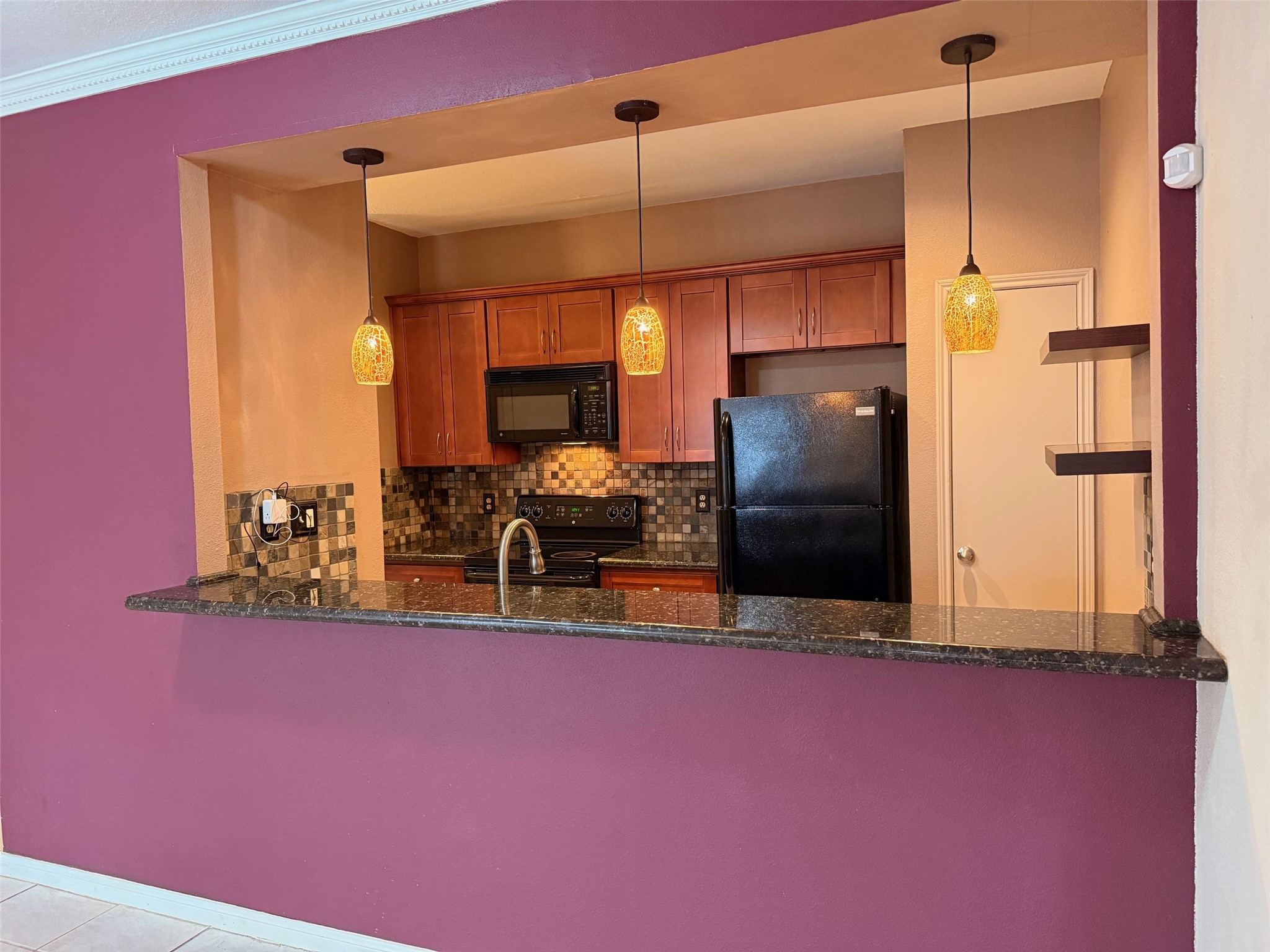4001 Tanglewilde Street, Unit 811 Houston, TX 77063 - Photo 1 of 38 a kitchen with refrigerator and window