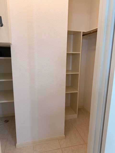 4001 Tanglewilde Street, Unit 811 Houston, TX 77063 - Photo 18 of 38 a view of an empty walk in closet