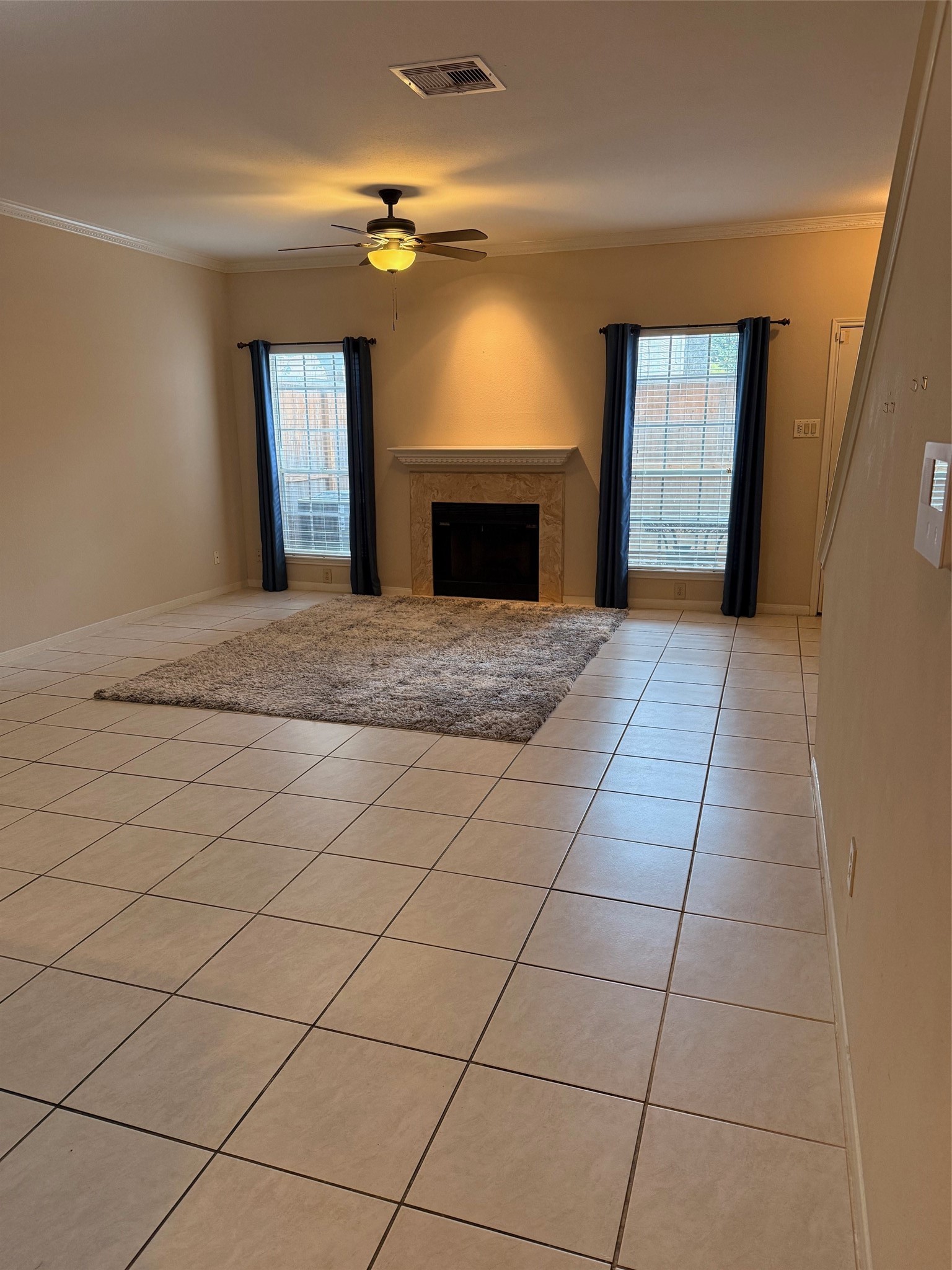 4001 Tanglewilde Street, Unit 811 Houston, TX 77063 - Photo 2 of 38 a view of an empty room with window and fireplace