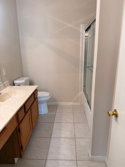 4001 Tanglewilde Street, Unit 811 Houston, TX 77063 - Photo 24 of 38 a bathroom with a sink a toilet and a mirror