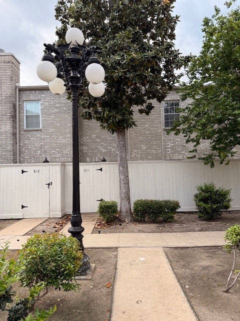 4001 Tanglewilde Street, Unit 811 Houston, TX 77063 - Photo 35 of 38 a front view of a house with lots of trees around it