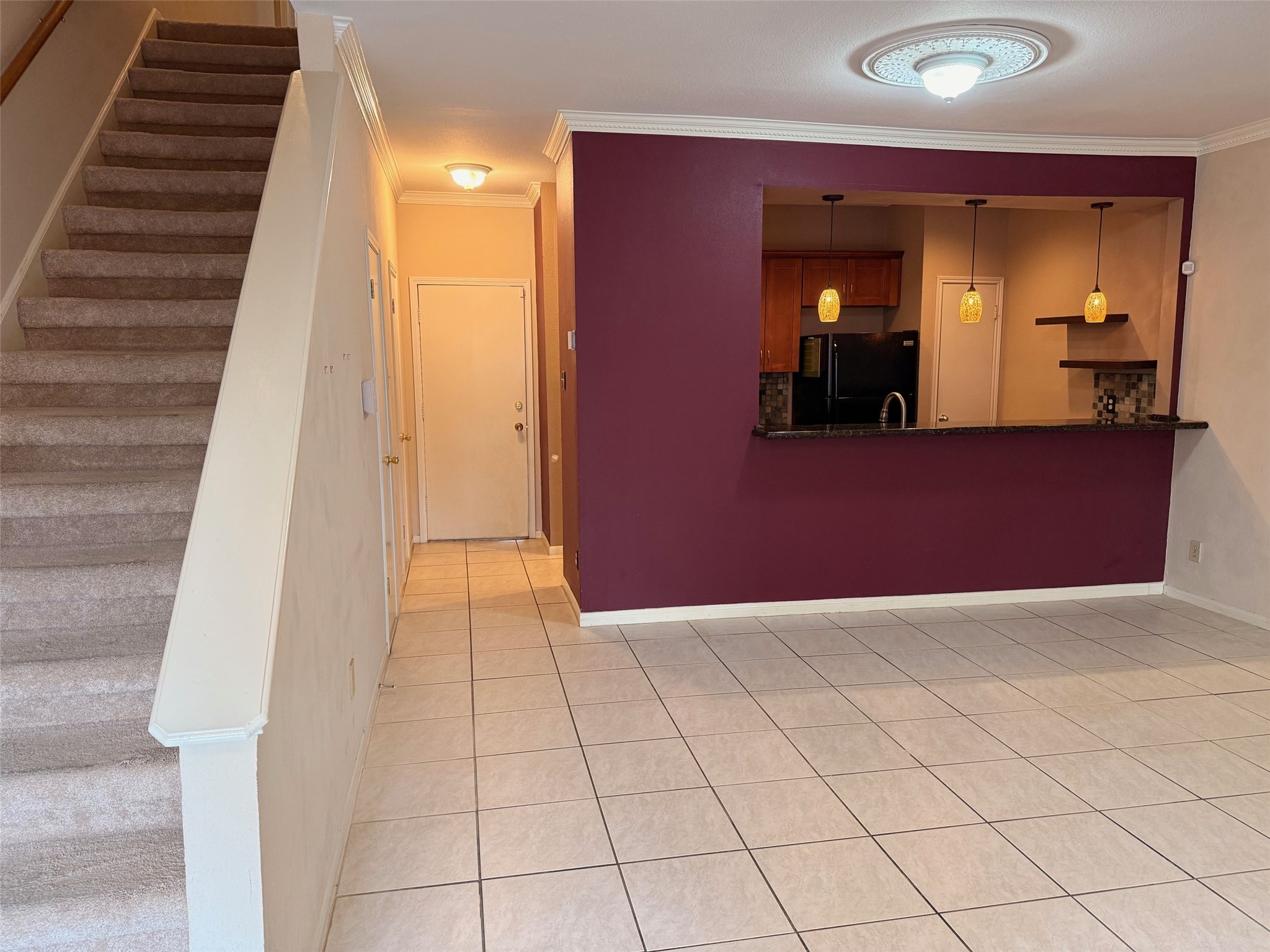 4001 Tanglewilde Street, Unit 811 Houston, TX 77063 - Photo 5 of 38 a view of a hallway with wooden floor and staircase