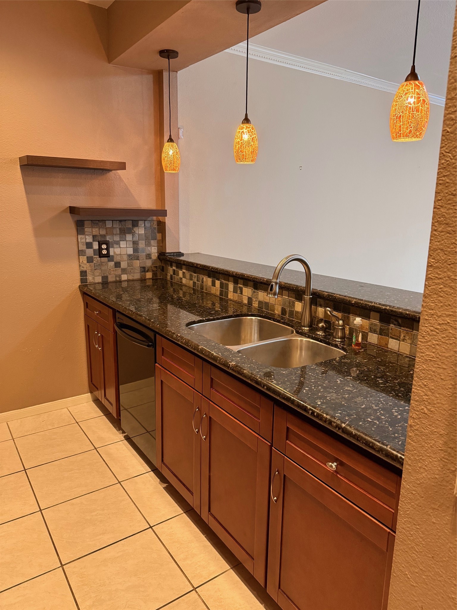 4001 Tanglewilde Street, Unit 811 Houston, TX 77063 - Photo 7 of 38 a kitchen with stainless steel appliances granite countertop a sink and cabinets
