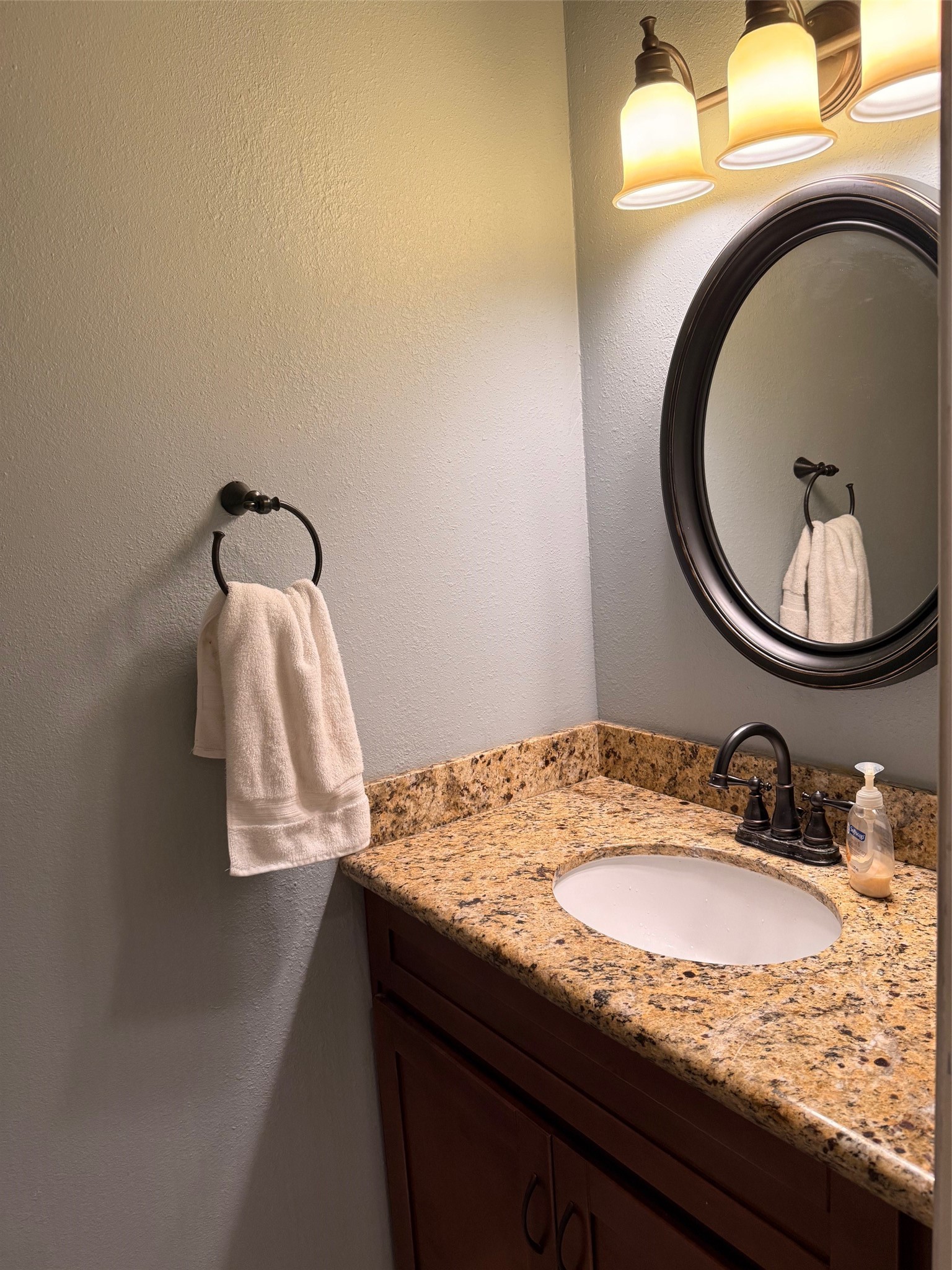 4001 Tanglewilde Street, Unit 811 Houston, TX 77063 - Photo 8 of 38 a bathroom with a granite countertop sink and a mirror
