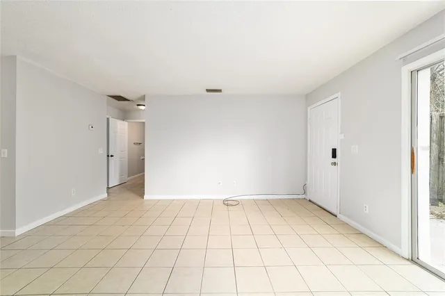 a view of an empty room and window