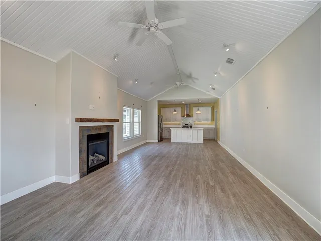 a view of kitchen and sink with wooden floor
