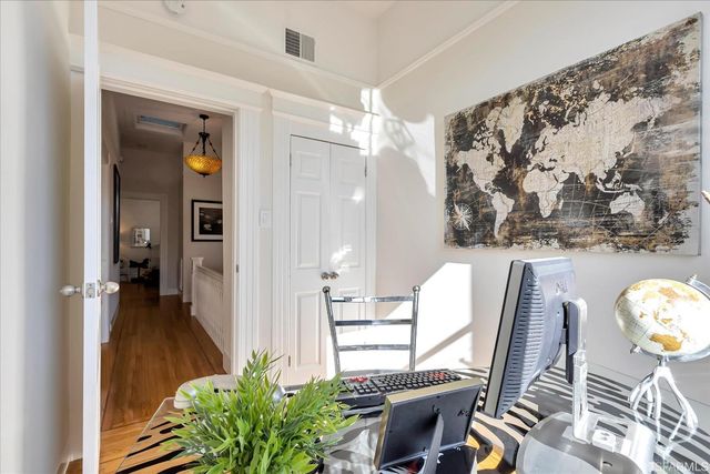 a view of a livingroom with furniture and wooden floor