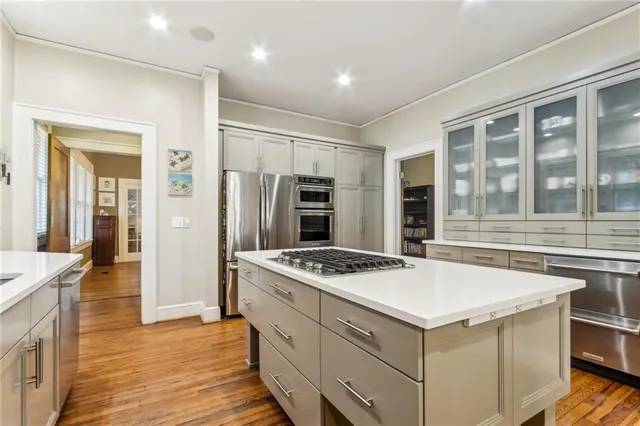 a kitchen that has a cabinets and a stove