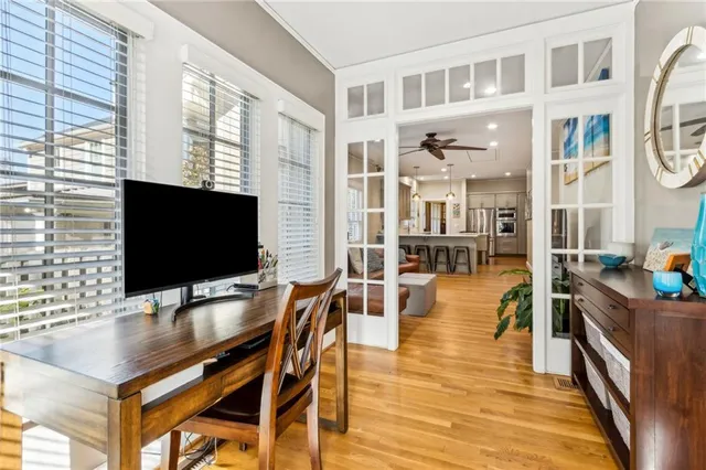 a view of a livingroom with furniture and a flat screen tv
