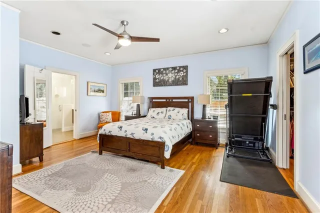 a bedroom with a bed dresser and a window