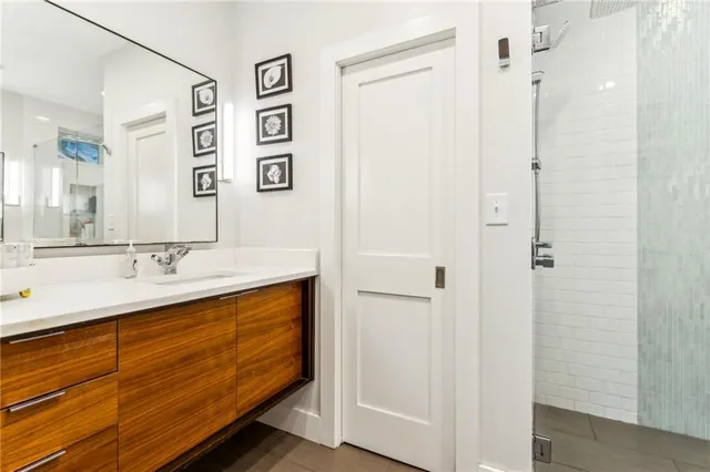 a bathroom with a double vanity sink and mirror