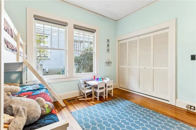 a bedroom with furniture and a window