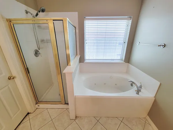 a white bath tub sitting next to a window
