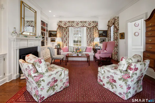 a living room with furniture and a chandelier