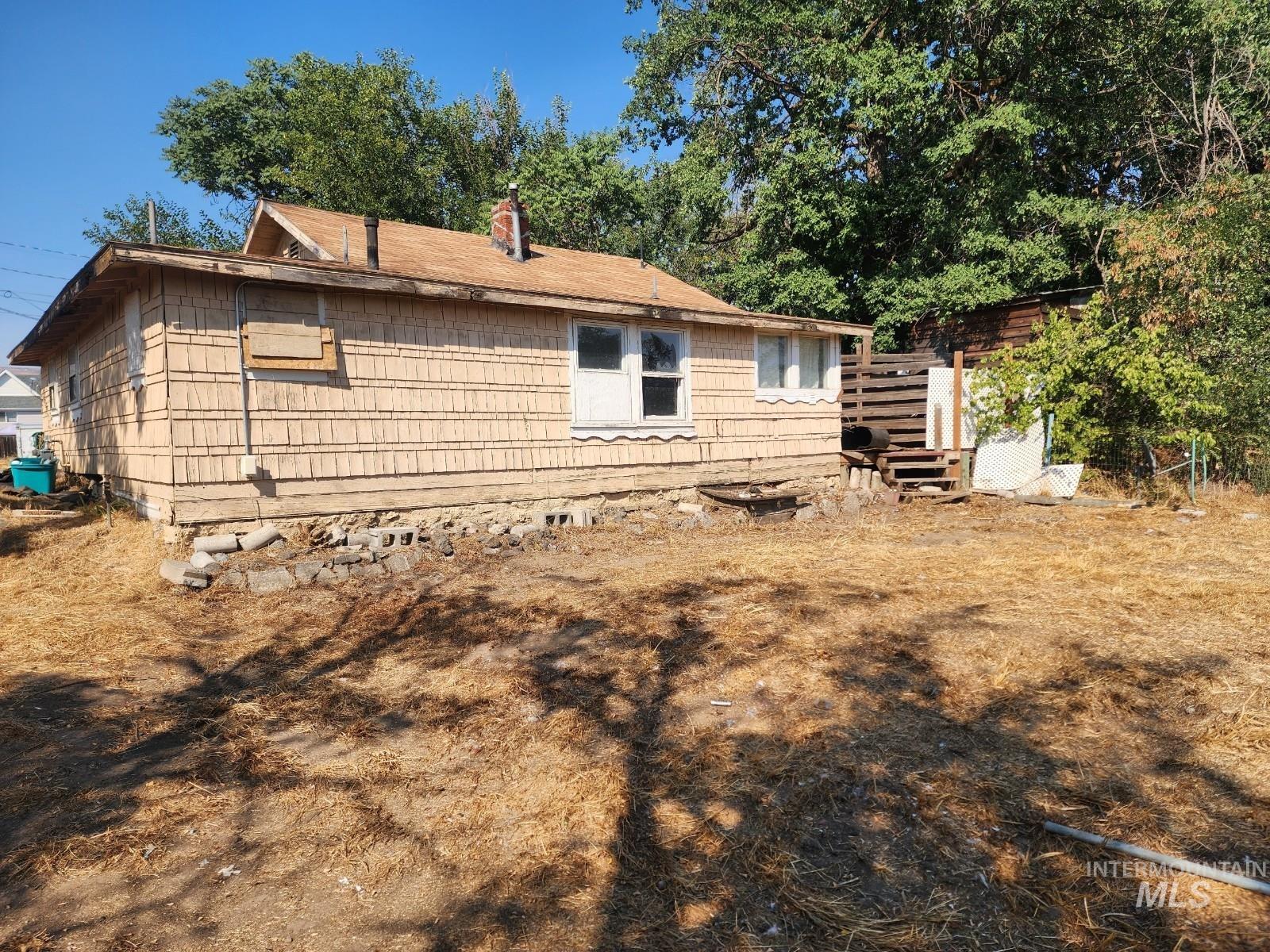 708 15th Avenue Lewiston, ID 83501 - Photo 12 of 12 Rear view of property with a chimney