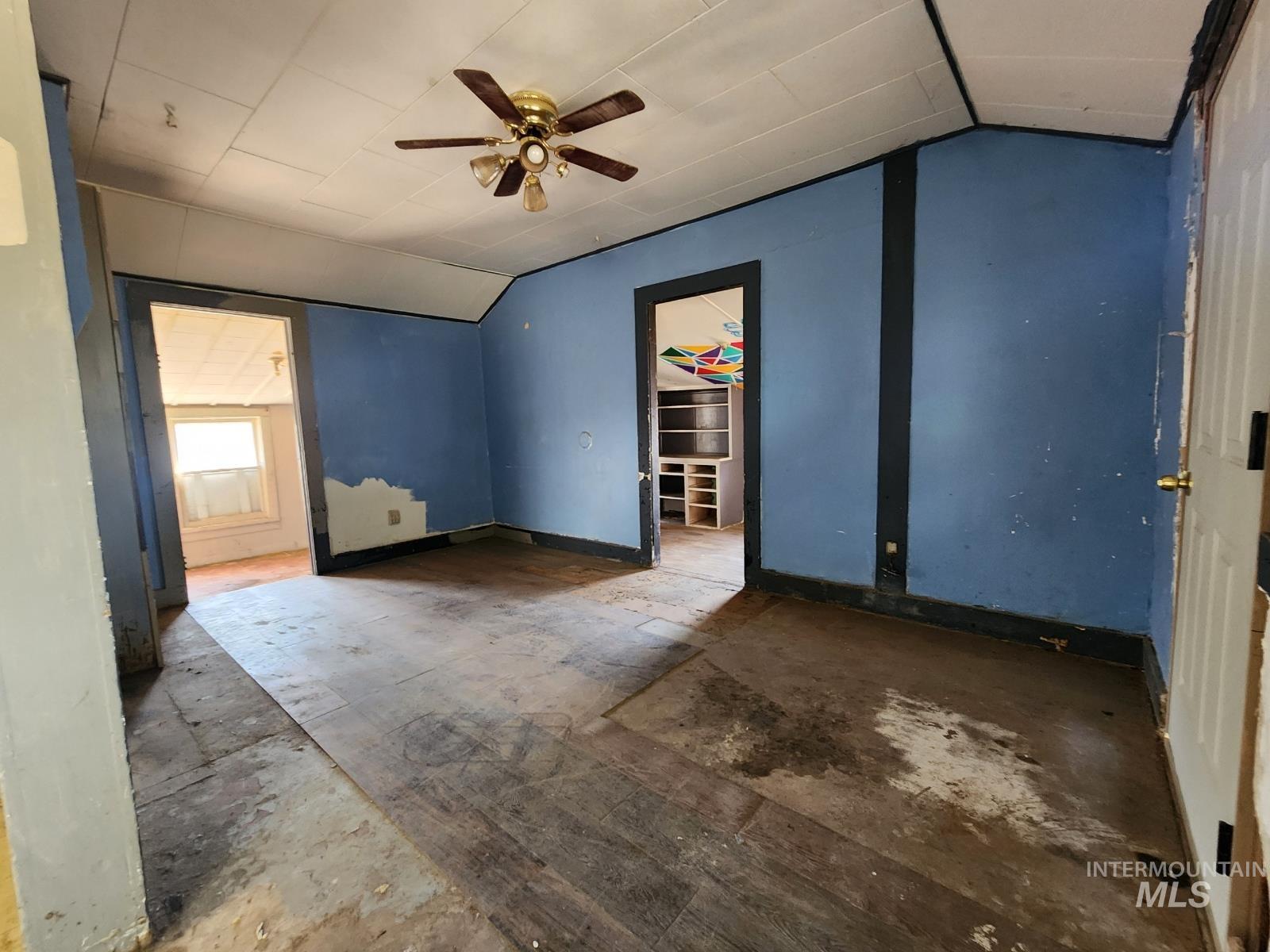 708 15th Avenue Lewiston, ID 83501 - Photo 6 of 12 Unfurnished bedroom featuring lofted ceiling and a ceiling fan