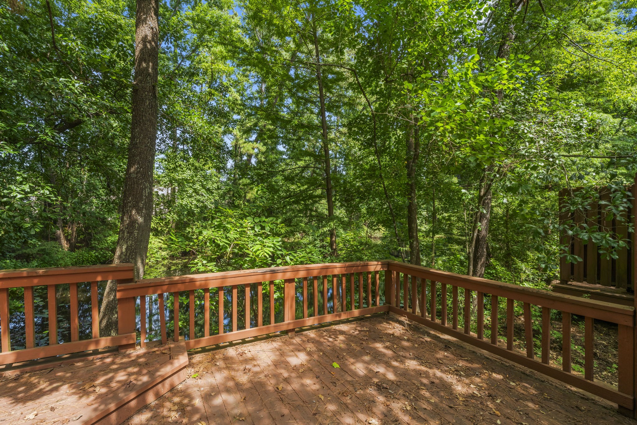 426 Nursery Road The Woodlands, TX 77380 - Photo 11 of 41 Custom deck and railing with gorgeous trees