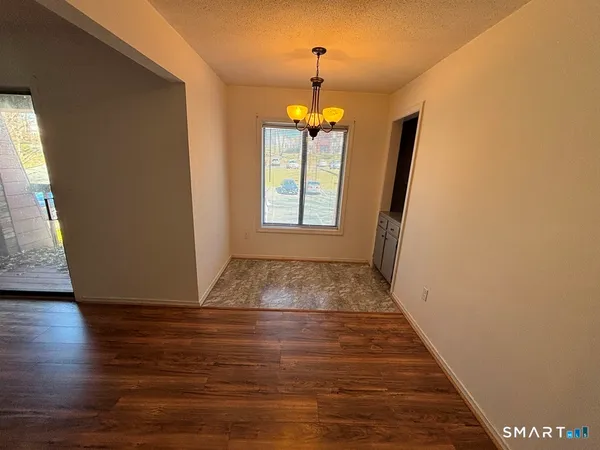 a view of entryway with wooden floor