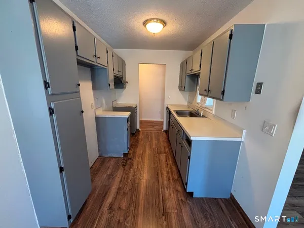 a room with wooden floor and furniture