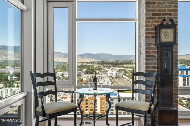 a bedroom with a bed and large window