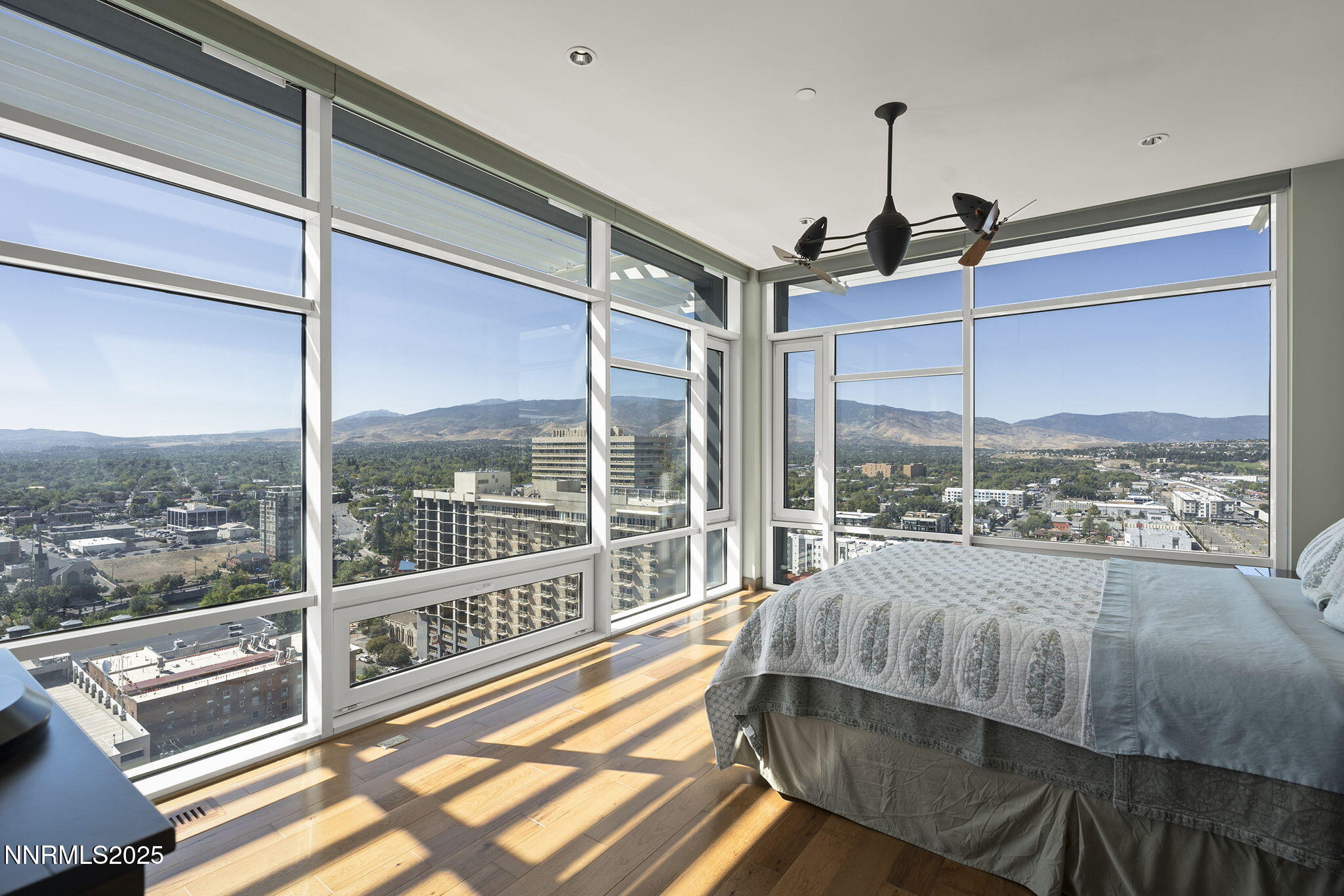 255 North Sierra Street, Unit 2303 Reno, NV 89501 - Photo 14 of 58 a bedroom with a bed and large window